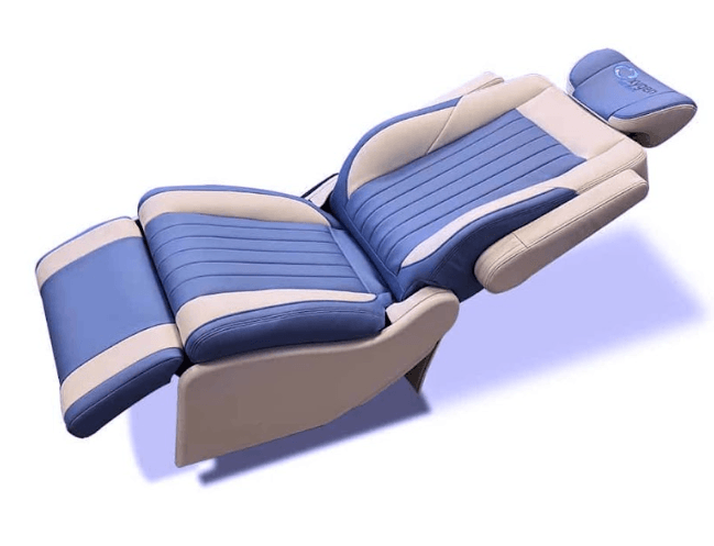 Fully reclined two-tone light blue and cream leather lounger chair with Oxygen branded headrest, vertical channel stitching, and padded bolsters